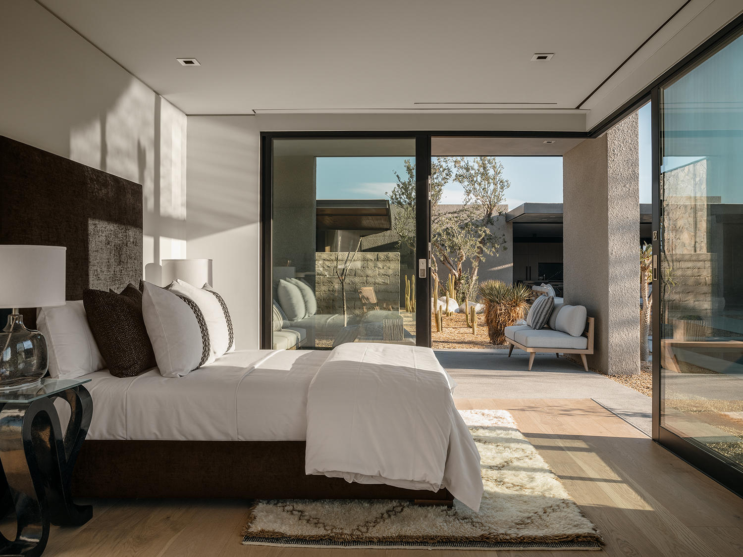 4 Echo Lane Rancho Mirage, CA 92270 - Photo 29 of 40 a bedroom with a large bed and large windows