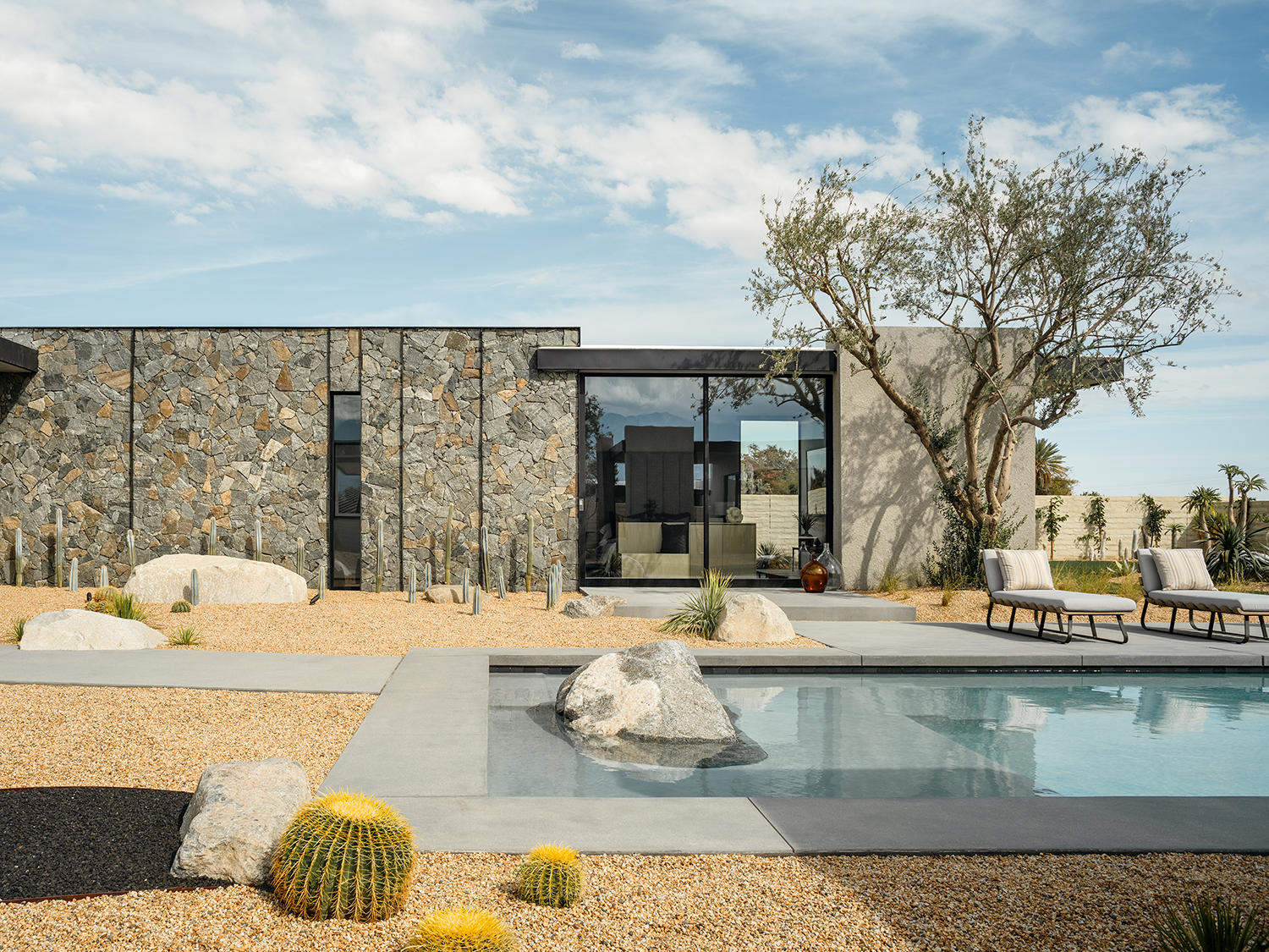 4 Echo Lane Rancho Mirage, CA 92270 - Photo 4 of 40 a view of a house with swimming pool and sitting area