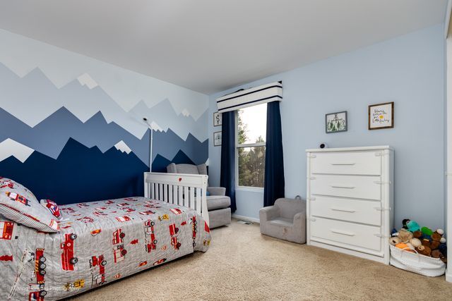 103 South Cranberry Street Bolingbrook, IL 60490 - Photo 20 of 33 a bedroom with a bed and a painting on the wall