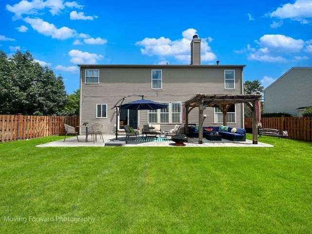 103 South Cranberry Street Bolingbrook, IL 60490 - Photo 3 of 33 a front view of house with yard patio and swimming pool