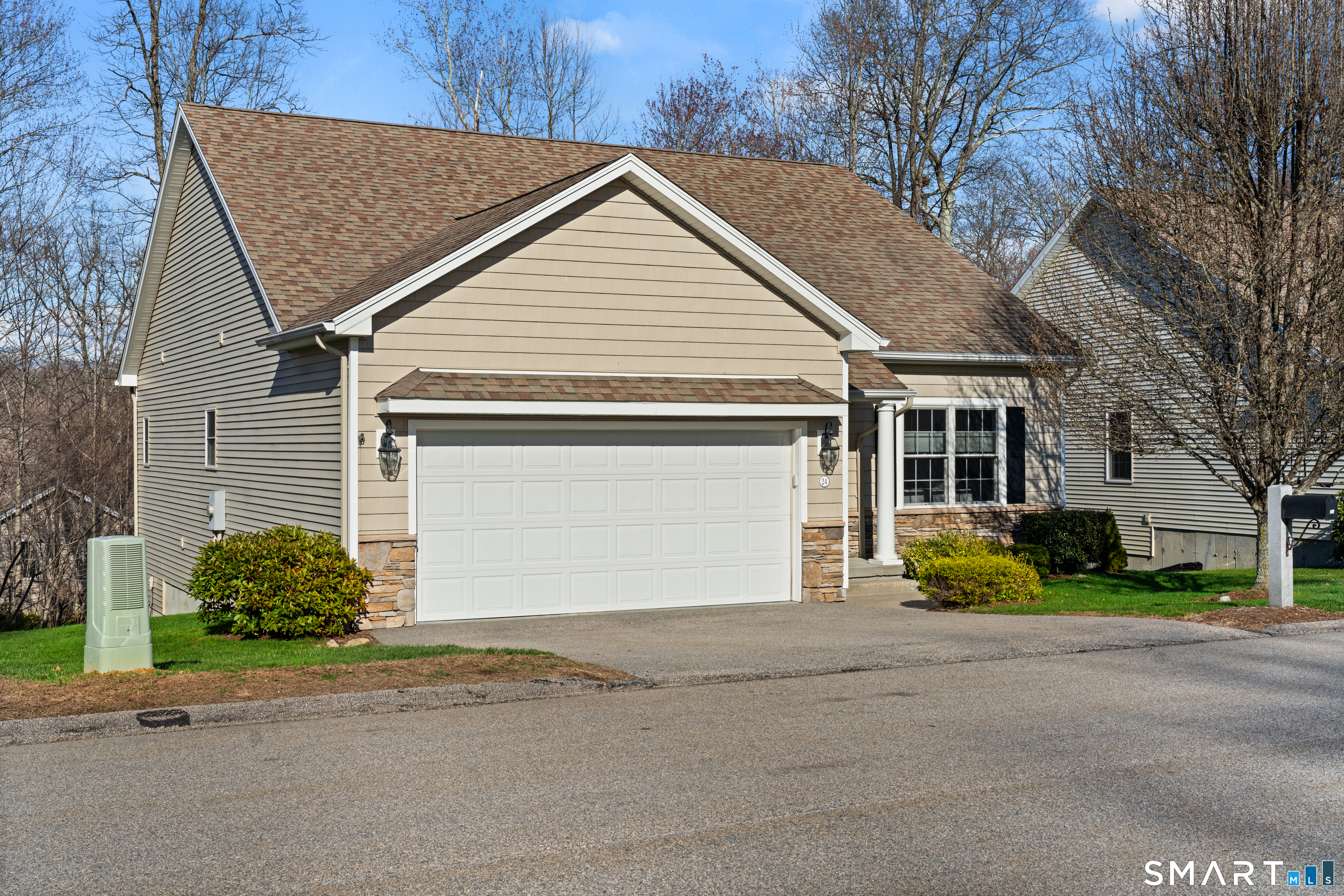 24 Center Court, Unit 24 Colchester, CT 06415 - Photo 1 of 36 a view of a house with a yard and garage