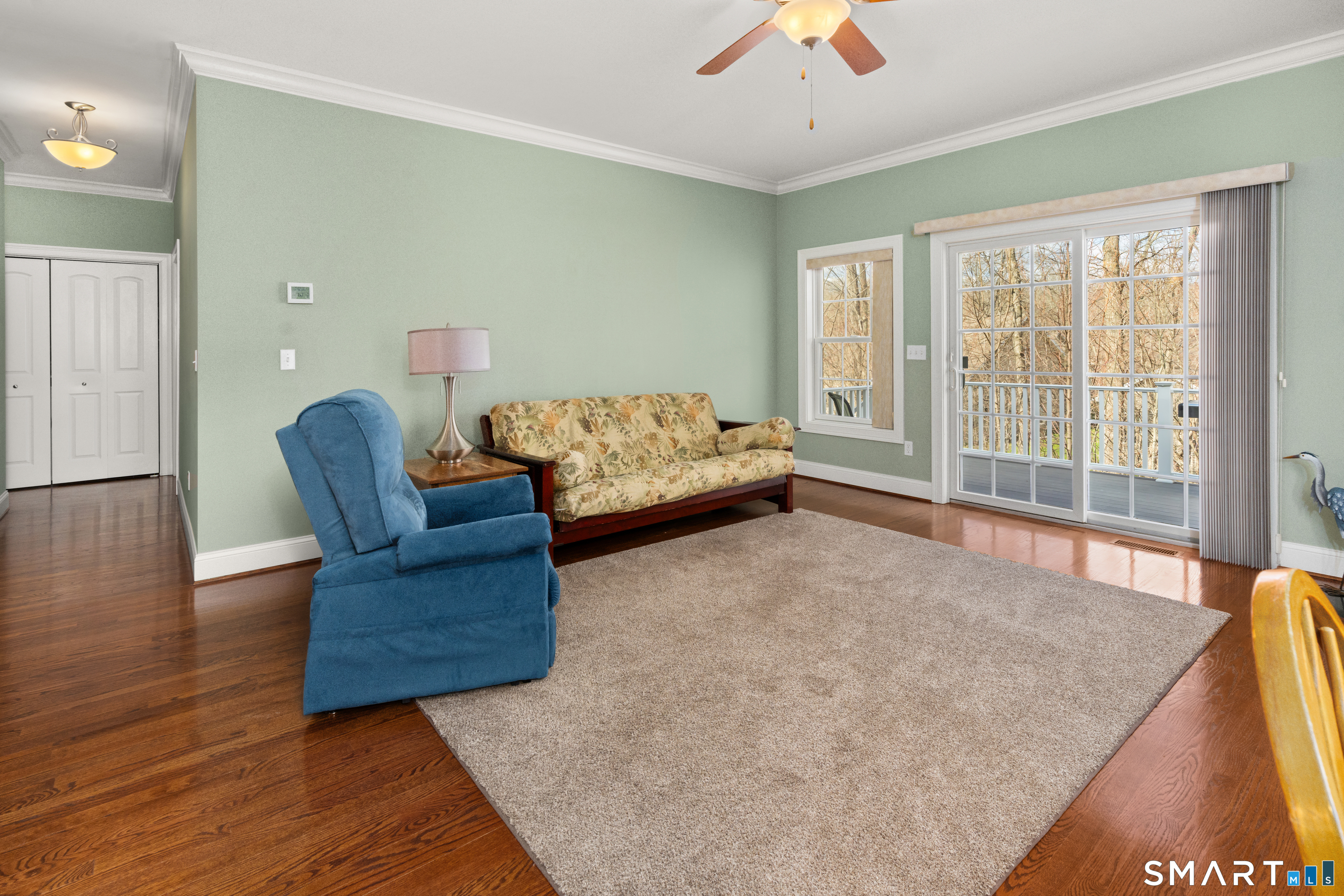 24 Center Court, Unit 24 Colchester, CT 06415 - Photo 12 of 36 a living room with furniture and a large window