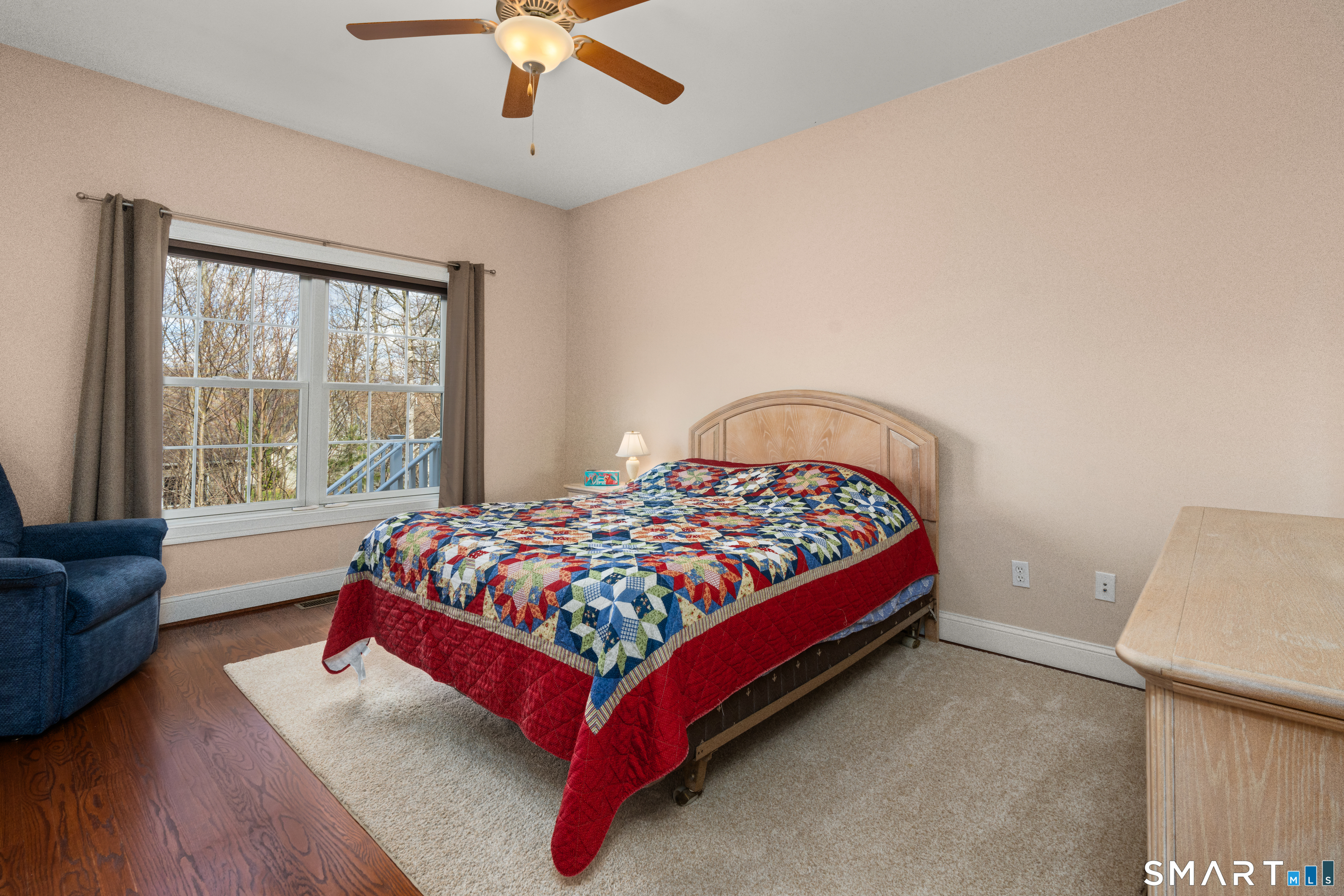 24 Center Court, Unit 24 Colchester, CT 06415 - Photo 14 of 36 a bed sitting in a bedroom next to a window