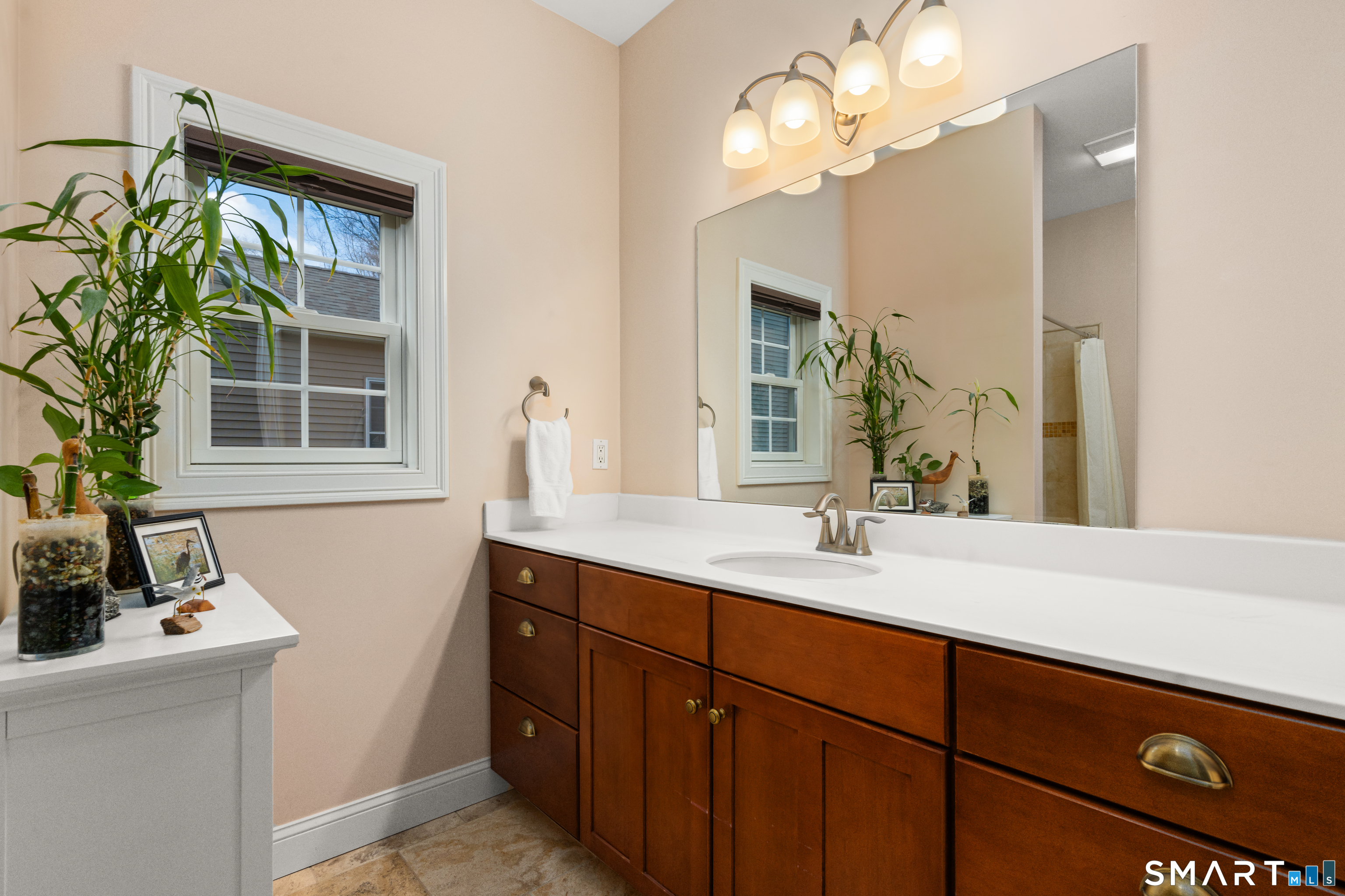 24 Center Court, Unit 24 Colchester, CT 06415 - Photo 15 of 36 a bathroom with a sink a vanity and a mirror