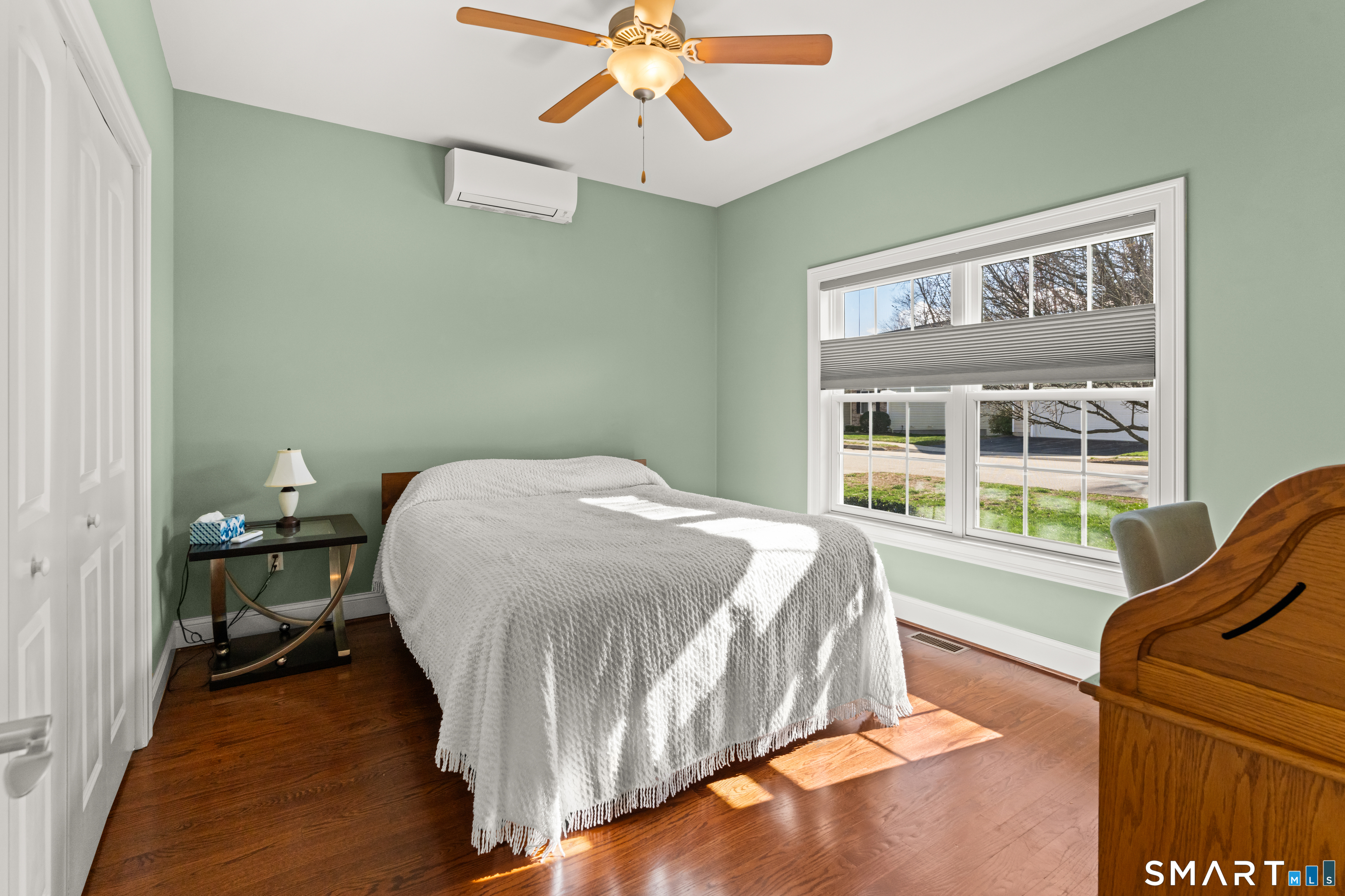 24 Center Court, Unit 24 Colchester, CT 06415 - Photo 18 of 36 a bedroom with a bed and a large window