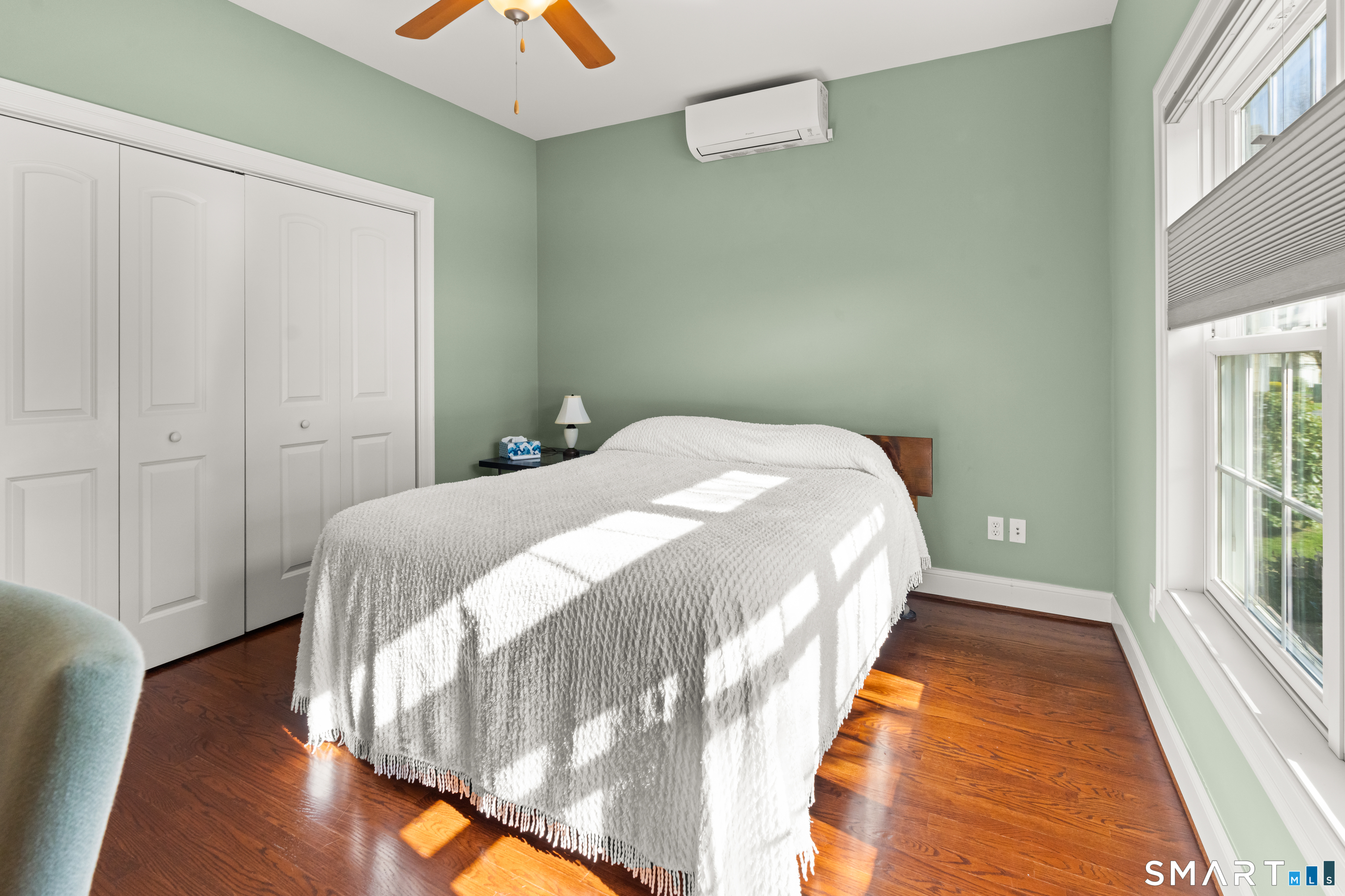 24 Center Court, Unit 24 Colchester, CT 06415 - Photo 20 of 36 a bed sitting in a bedroom next to a window