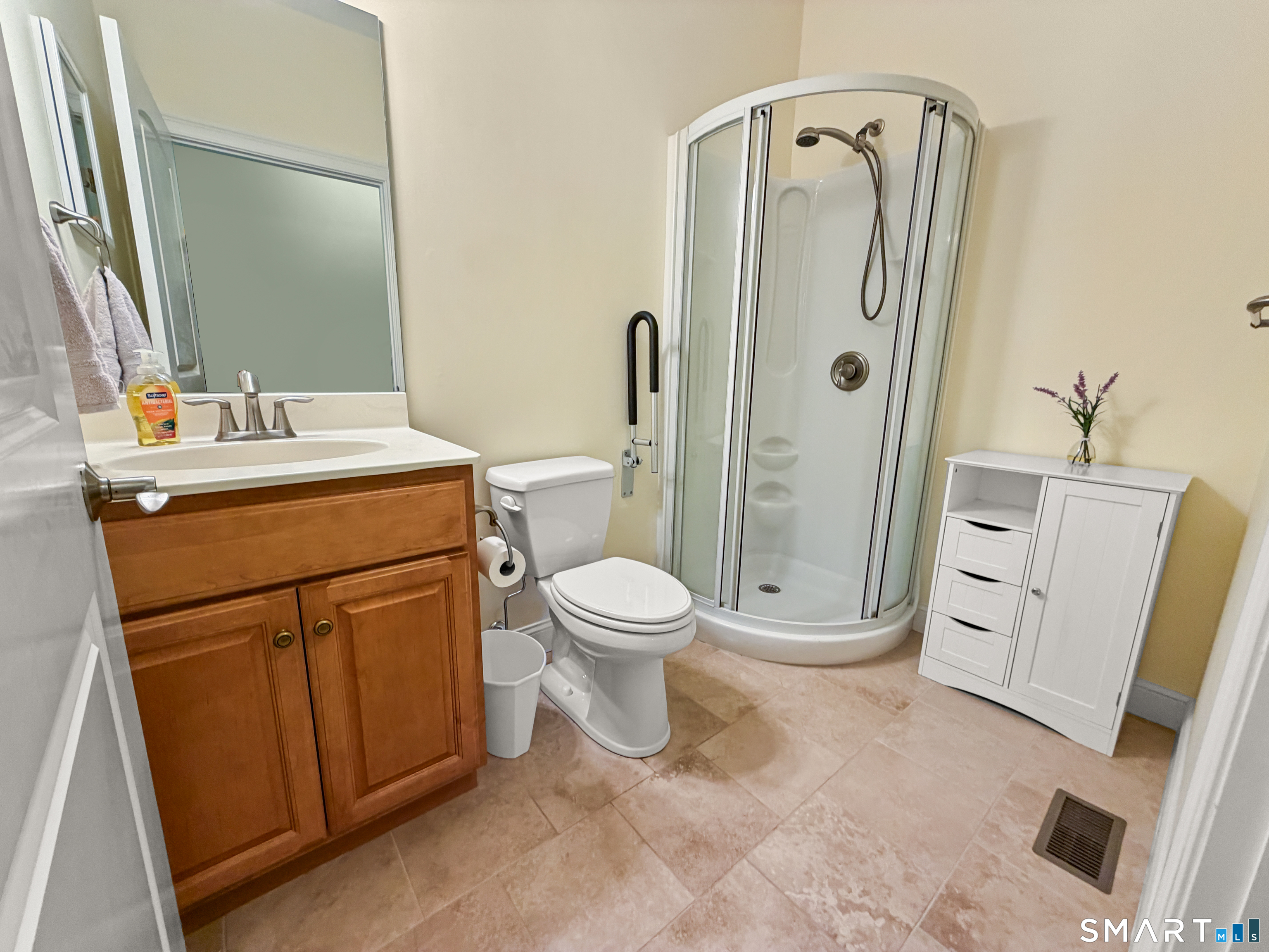 24 Center Court, Unit 24 Colchester, CT 06415 - Photo 22 of 36 a bathroom with a granite countertop sink toilet and shower