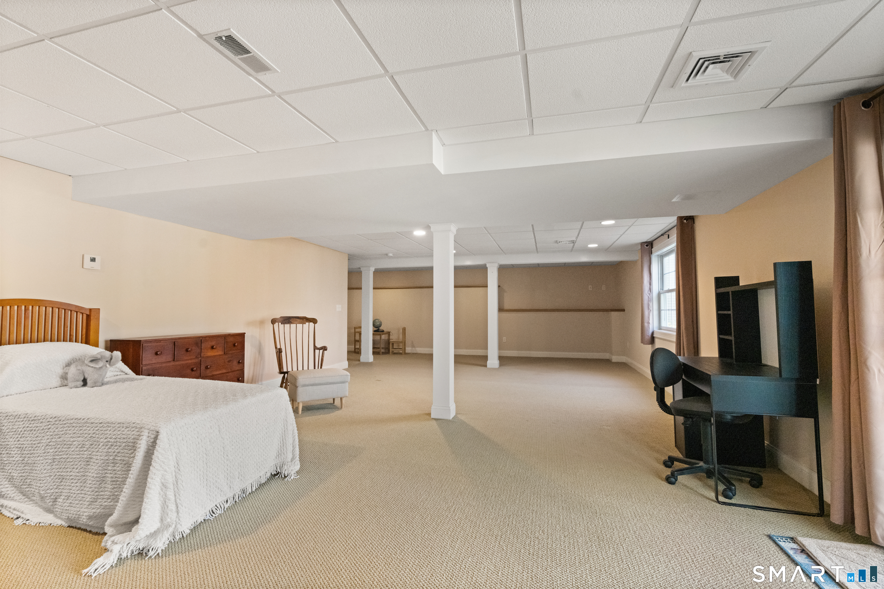 24 Center Court, Unit 24 Colchester, CT 06415 - Photo 25 of 36 a bedroom with furniture and a ceiling fan