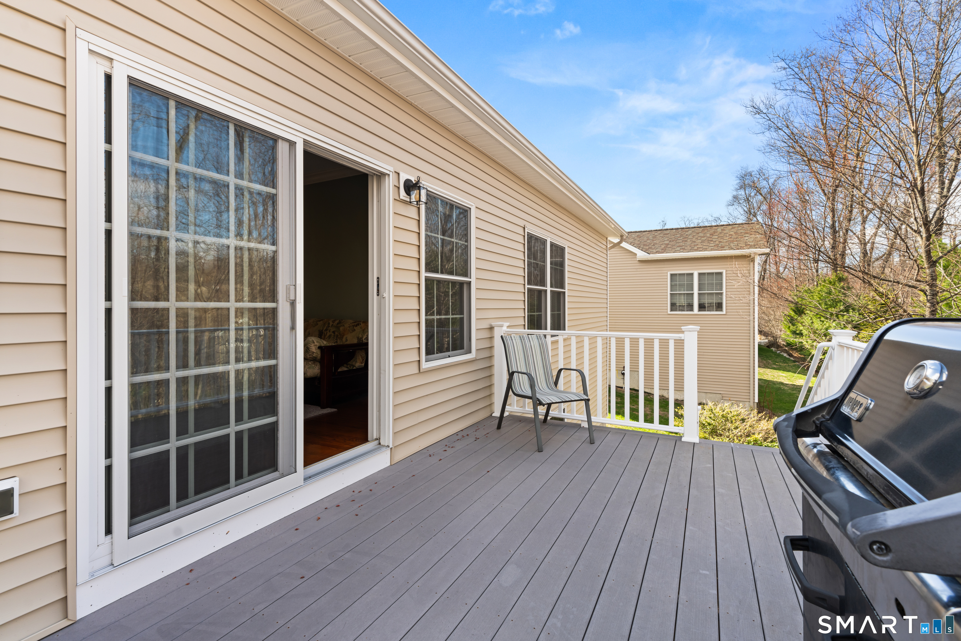 24 Center Court, Unit 24 Colchester, CT 06415 - Photo 29 of 36 a view of roof deck with chair and wooden floor