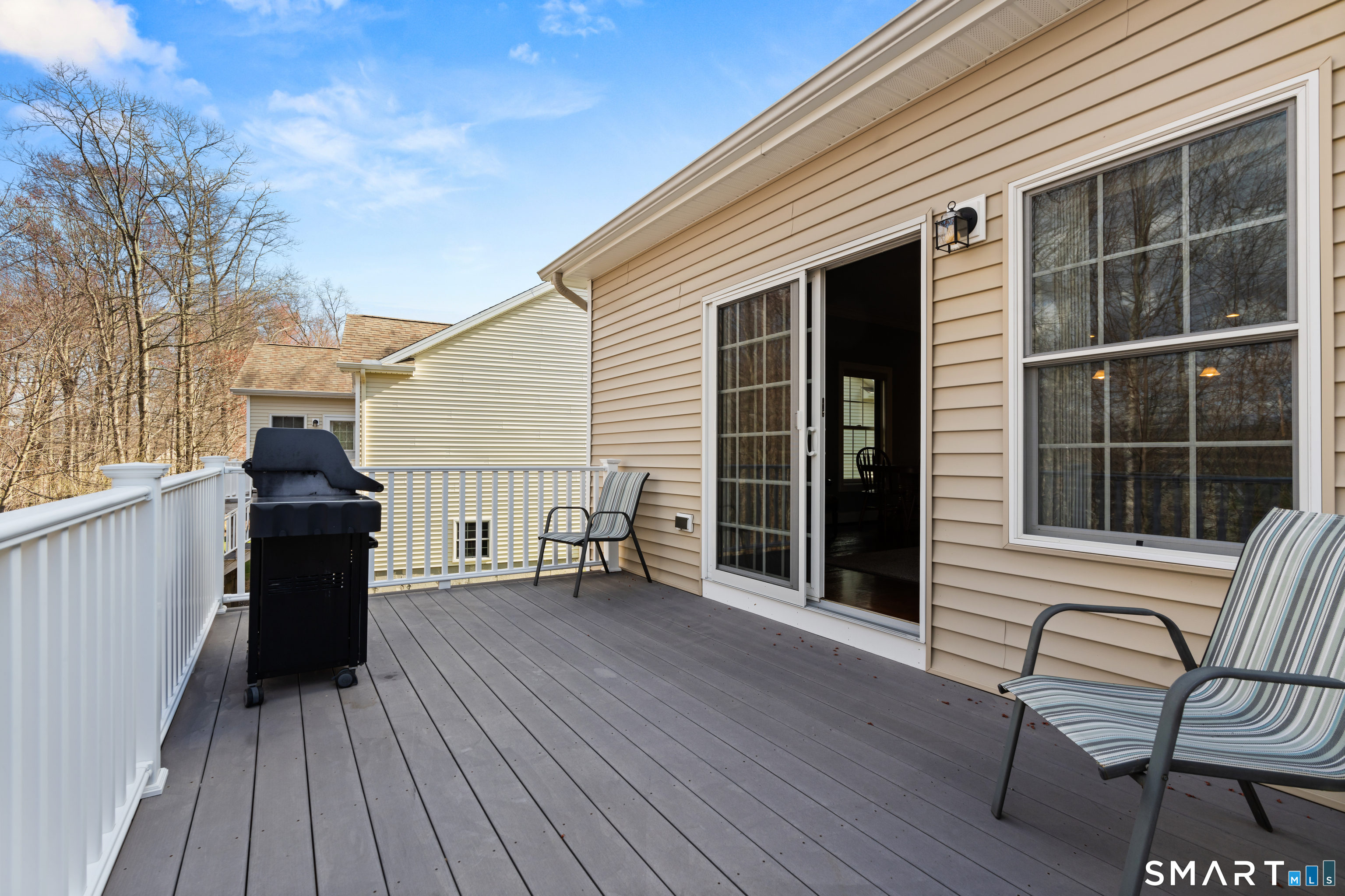 24 Center Court, Unit 24 Colchester, CT 06415 - Photo 30 of 36 a view of a deck with wooden floor and seating space