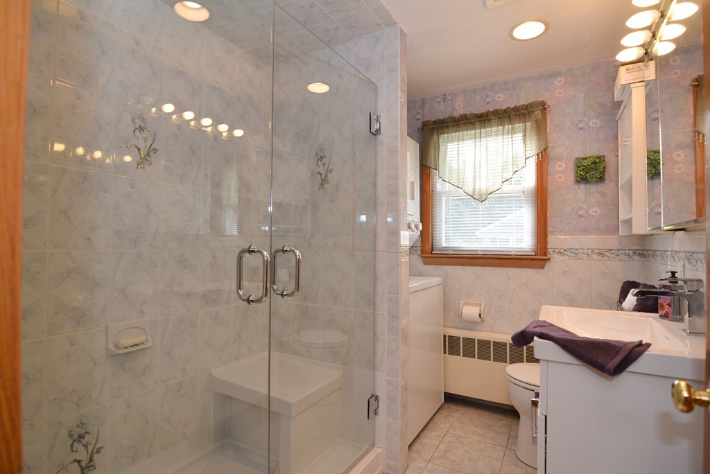 6 Cardinal Road Stoneham, MA 02180 - Photo 13 of 27 a bathroom with a toilet sink and shower