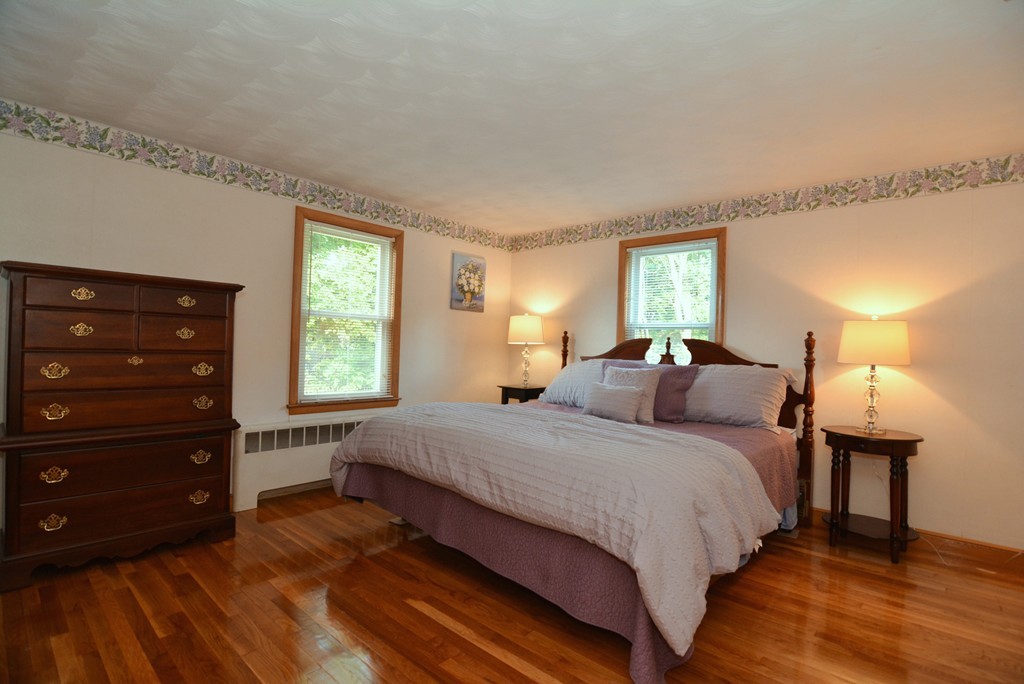 6 Cardinal Road Stoneham, MA 02180 - Photo 15 of 27 a bedroom with a bed and a closet