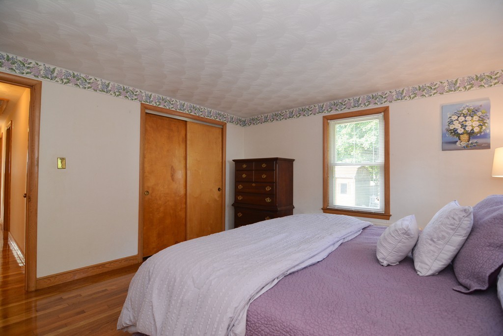 6 Cardinal Road Stoneham, MA 02180 - Photo 16 of 27 a bedroom with a bed and a window