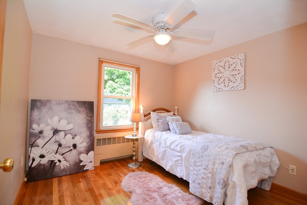 6 Cardinal Road Stoneham, MA 02180 - Photo 17 of 27 a bedroom with a large bed and a window