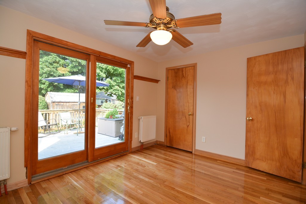 6 Cardinal Road Stoneham, MA 02180 - Photo 18 of 27 wooden floor in an empty room with a window
