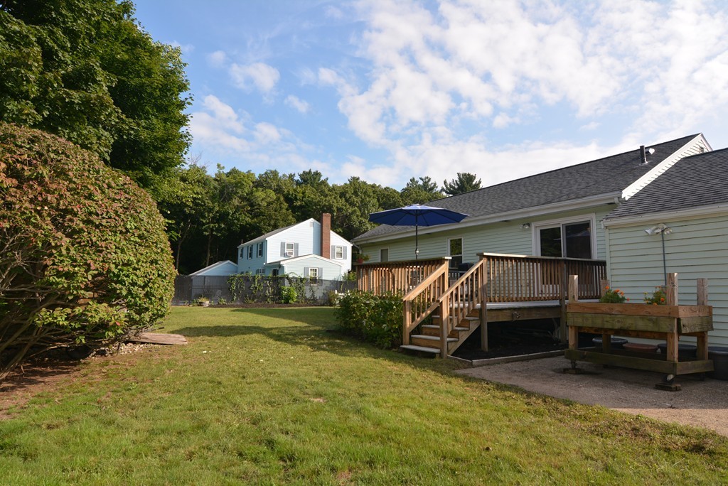 6 Cardinal Road Stoneham, MA 02180 - Photo 26 of 27 a view of a house with a back yard