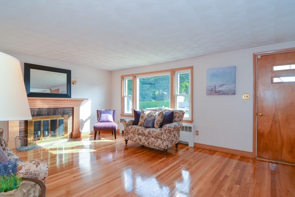 6 Cardinal Road Stoneham, MA 02180 - Photo 4 of 27 a living room with furniture and a fireplace