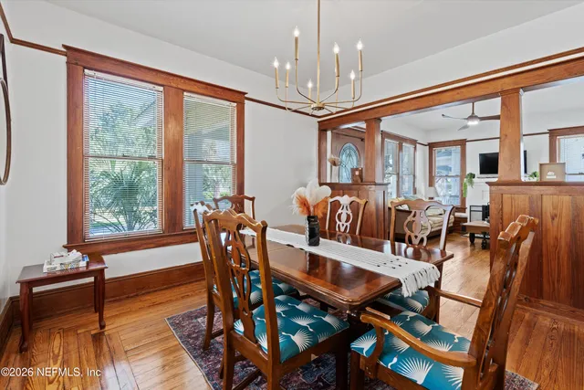 a view of a dining room with furniture window and wooden floor