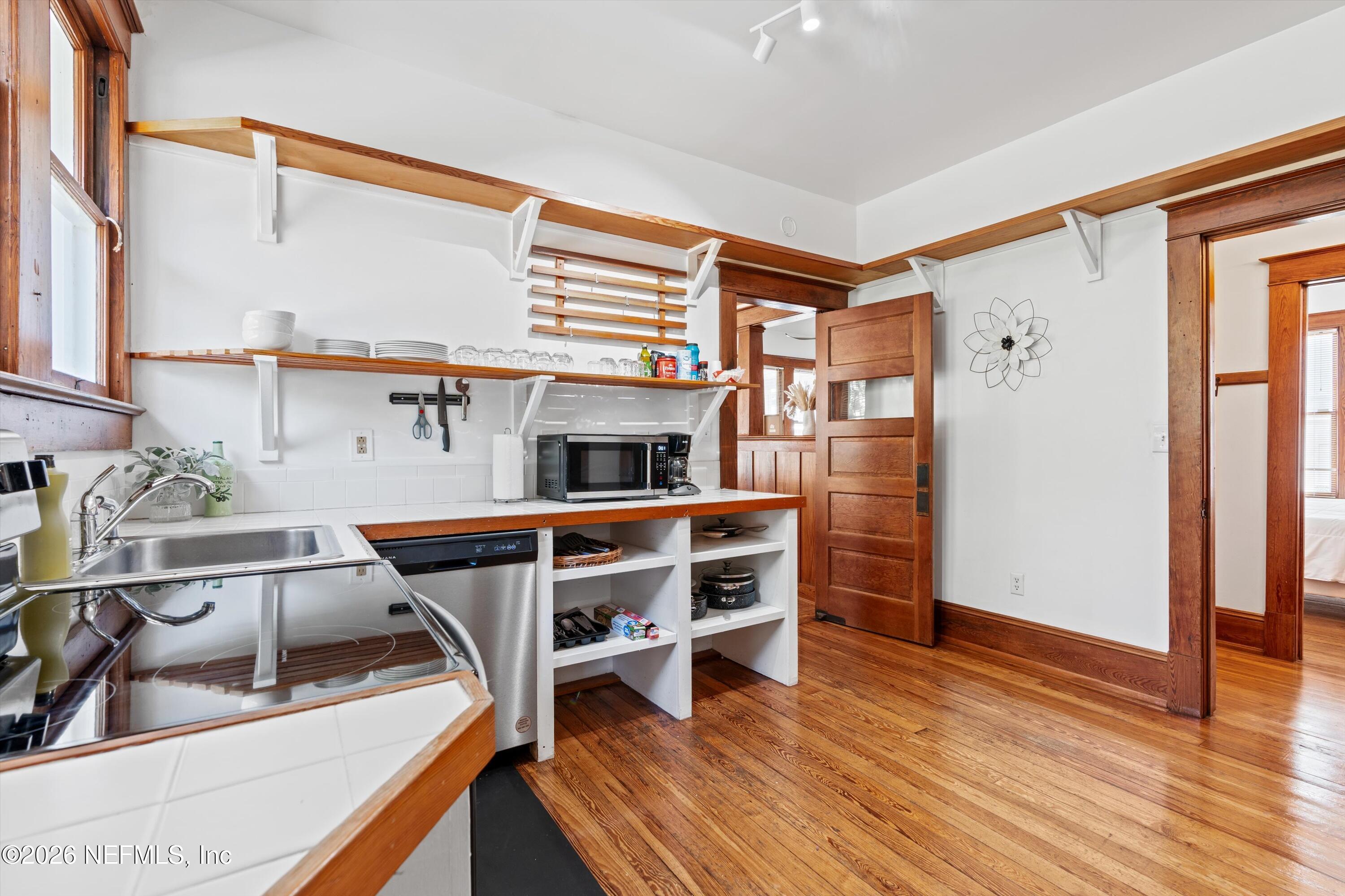 33 Cincinnati Avenue St. Augustine, FL 32084 - Photo 12 of 37 a view of kitchen with cabinets and wooden floor