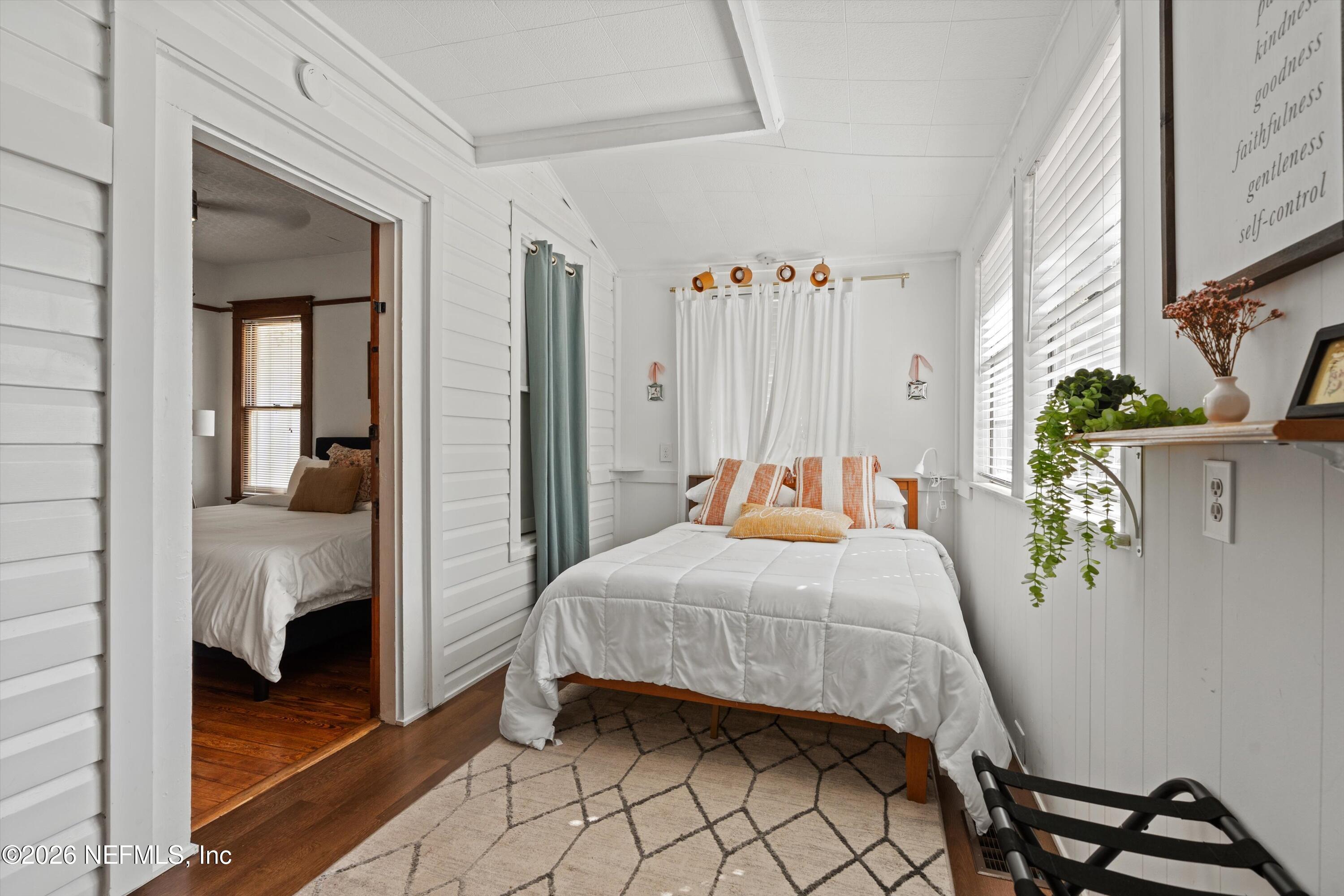 33 Cincinnati Avenue St. Augustine, FL 32084 - Photo 20 of 37 a bedroom with a bed and a mirror