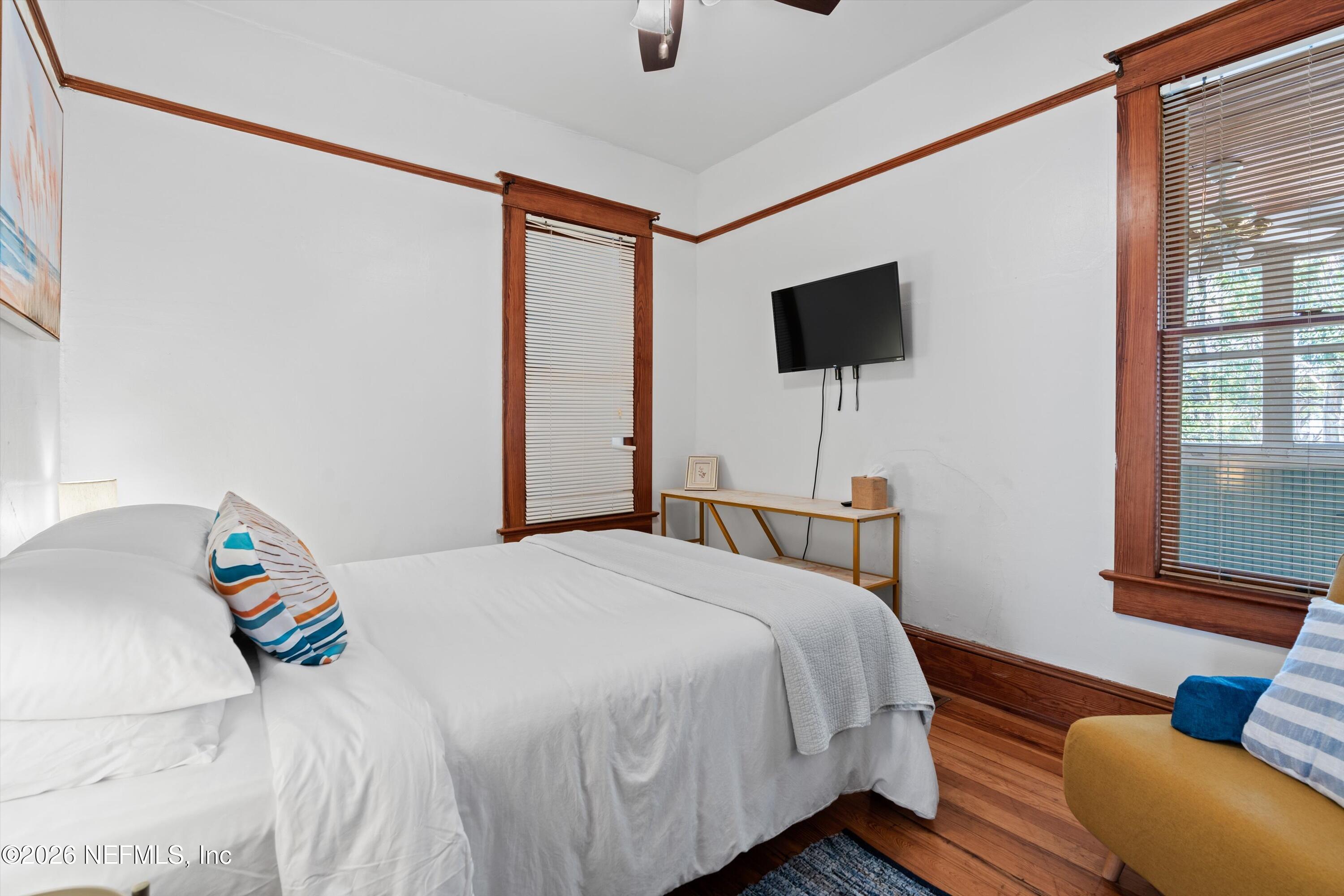 33 Cincinnati Avenue St. Augustine, FL 32084 - Photo 25 of 37 a bedroom with a bed and glass window