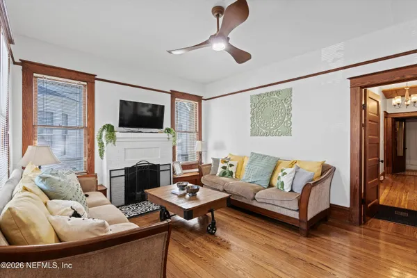 a bedroom with furniture and large window