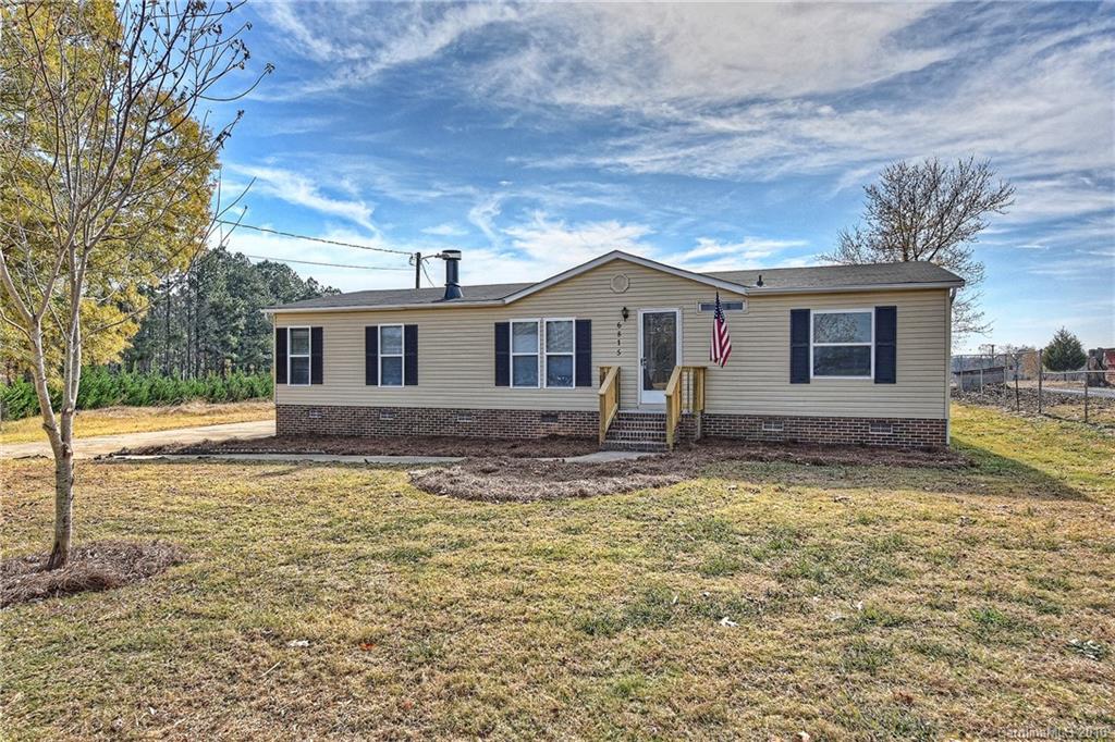 6815 Lackey Road, Unit 1 Vale, NC 28168 - Photo 1 of 24 a view of a house with a yard