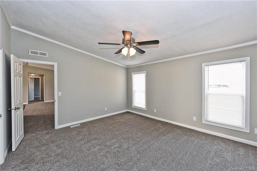 6815 Lackey Road, Unit 1 Vale, NC 28168 - Photo 12 of 24 a view of a room with a ceiling fan and a window