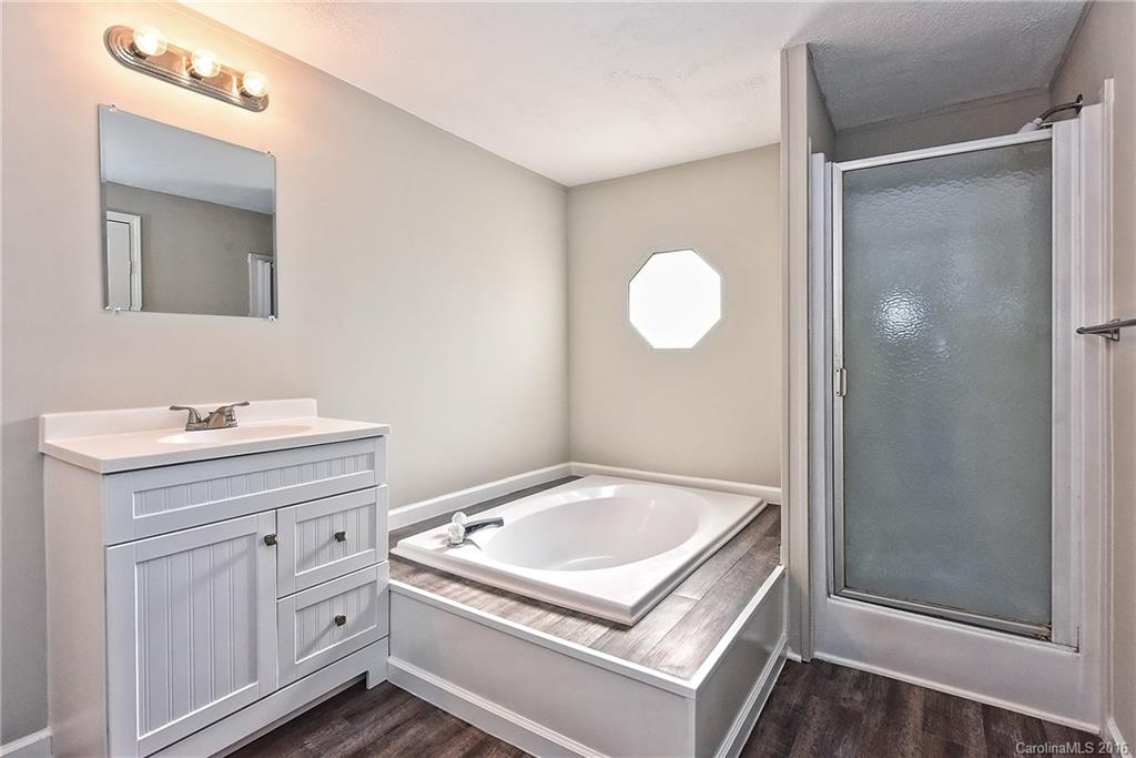 6815 Lackey Road, Unit 1 Vale, NC 28168 - Photo 14 of 24 a bathroom with a sink and a mirror