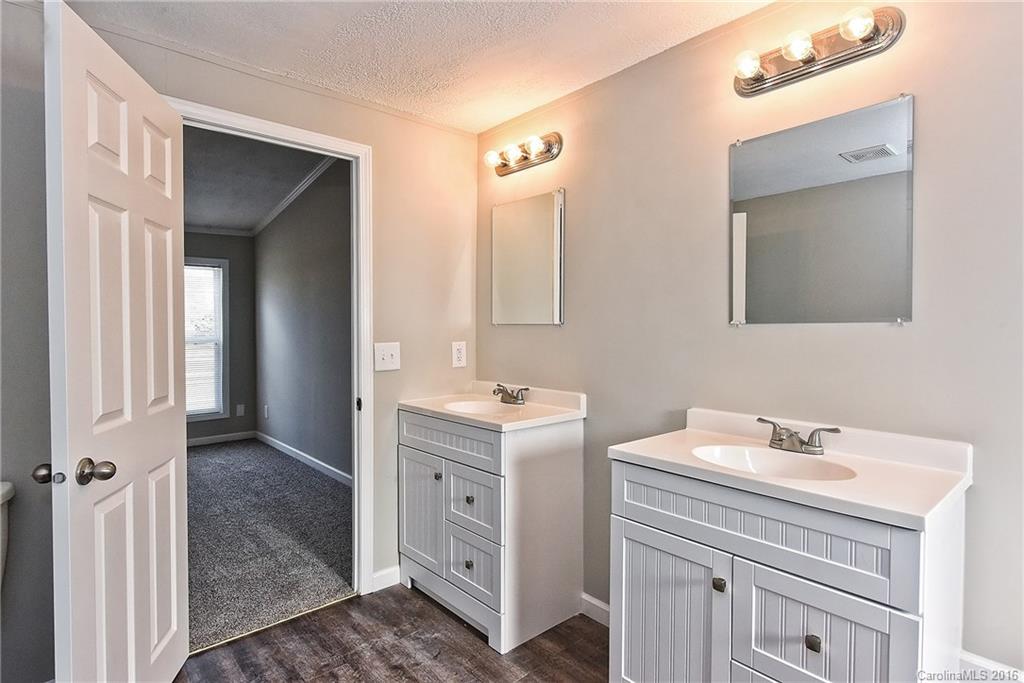 6815 Lackey Road, Unit 1 Vale, NC 28168 - Photo 15 of 24 a bathroom with a double vanity sink mirror and