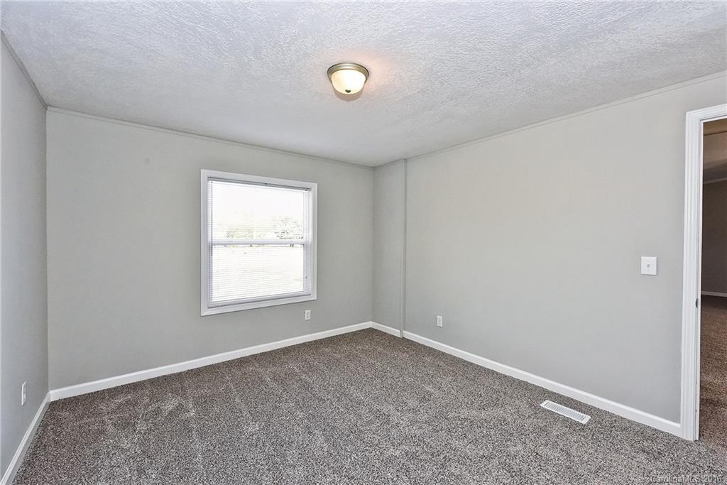 6815 Lackey Road, Unit 1 Vale, NC 28168 - Photo 19 of 24 an empty room with a window