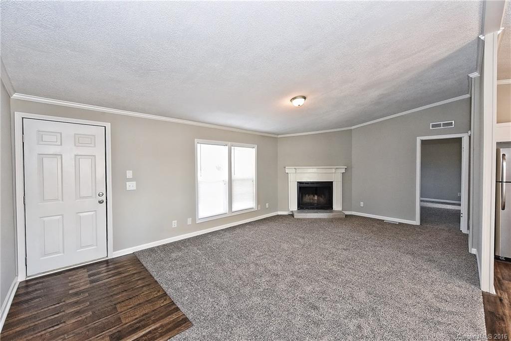 6815 Lackey Road, Unit 1 Vale, NC 28168 - Photo 3 of 24 a view of an empty room with window and fire place