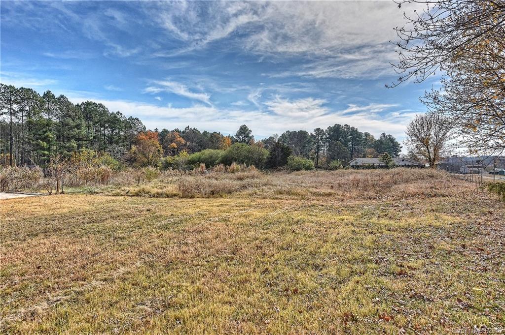 6815 Lackey Road, Unit 1 Vale, NC 28168 - Photo 22 of 24 a view of a field of grass and trees