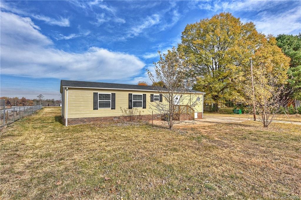 6815 Lackey Road, Unit 1 Vale, NC 28168 - Photo 23 of 24 a front view of a house with a yard