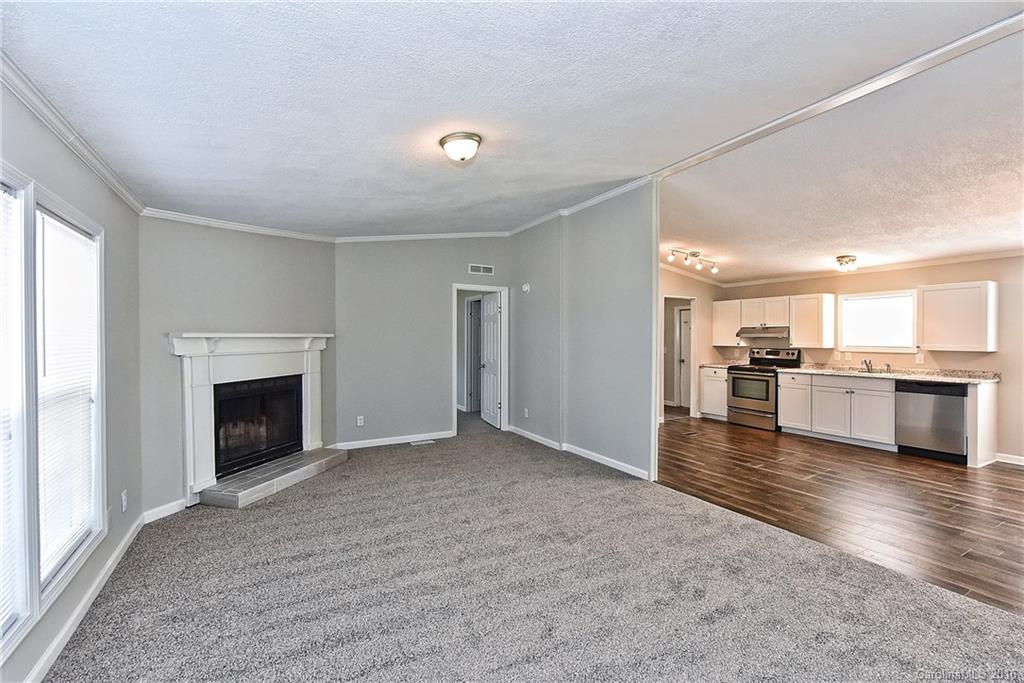 6815 Lackey Road, Unit 1 Vale, NC 28168 - Photo 5 of 24 a view of a kitchen with a sink and a fireplace