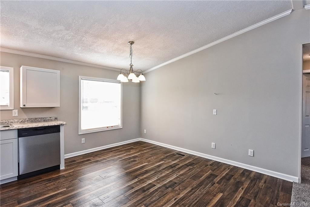 6815 Lackey Road, Unit 1 Vale, NC 28168 - Photo 9 of 24 wooden floor in an empty room with a window