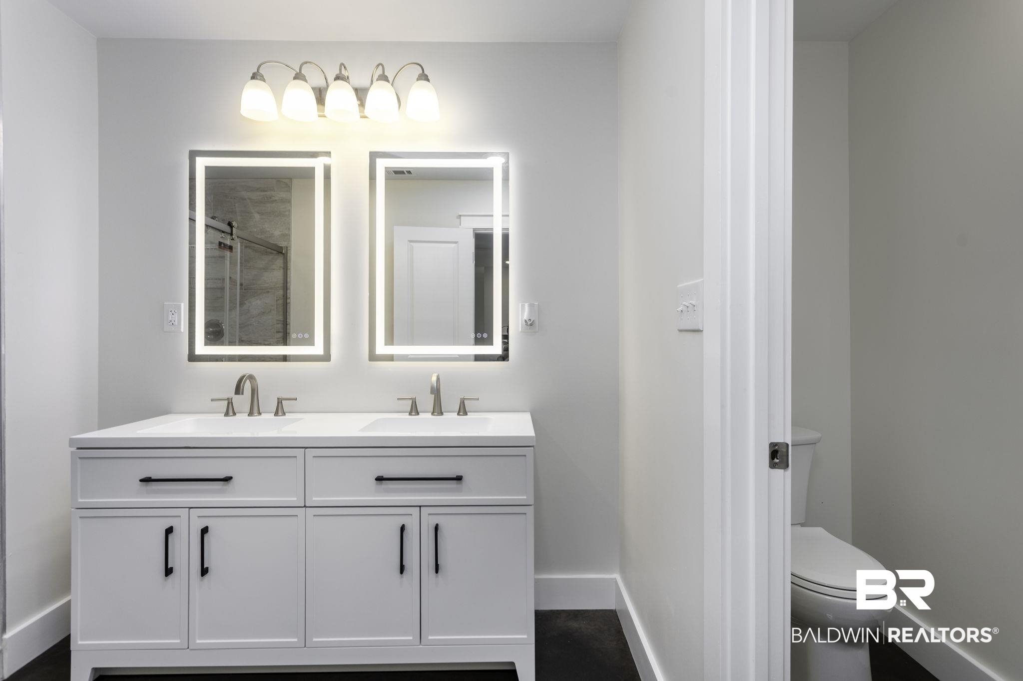 17126 Sugar Loop Foley, AL 36535 - Photo 12 of 28 Bathroom featuring double vanity and a tile shower
