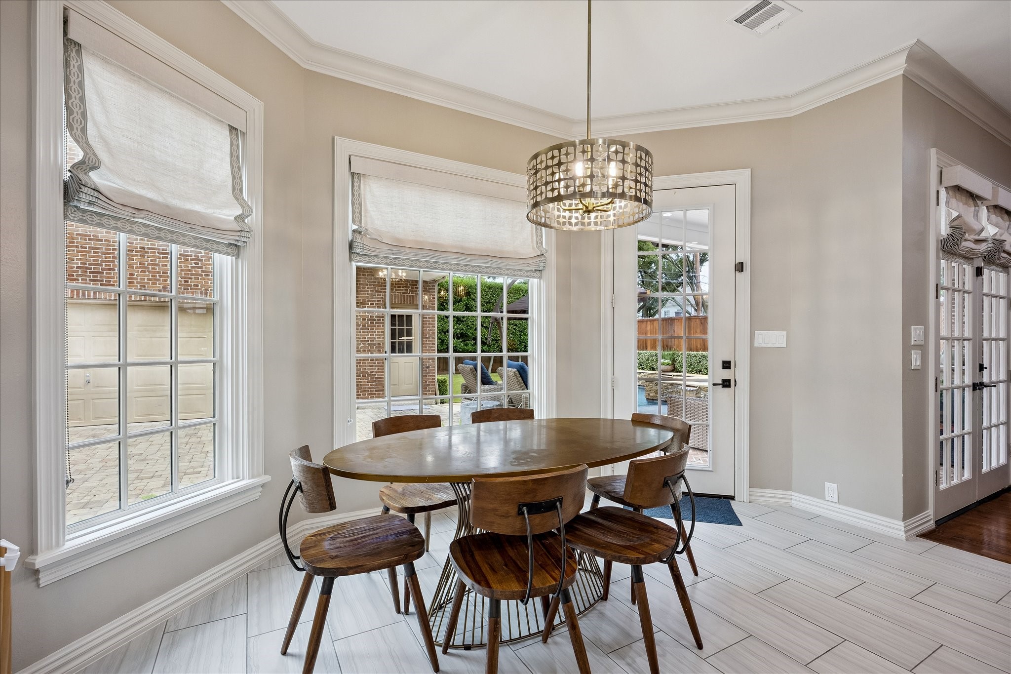 6358 Auden Street Houston, TX 77005 - Photo 16 of 50 a view of a dining room with furniture window and wooden floor