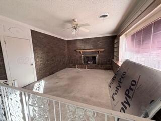 5204 Albert Avenue Amarillo, TX 79106 - Photo 2 of 17 a bedroom with a bed and a fireplace