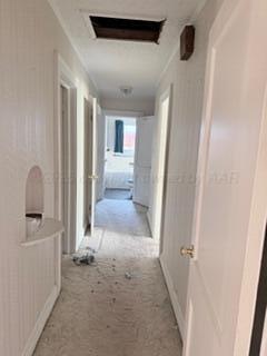 5204 Albert Avenue Amarillo, TX 79106 - Photo 7 of 17 a view of a hallway to a livingroom with wooden floor and windows