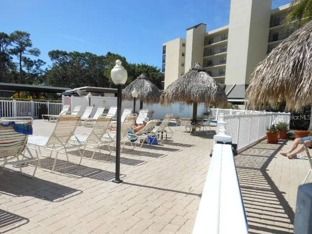 a view of a swimming pool with a lounge chairs