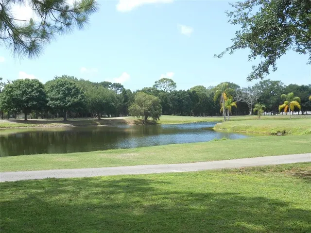 a view of a house with a flower garden