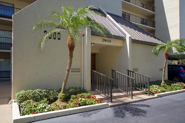 a table with chairs and couches in a kitchen