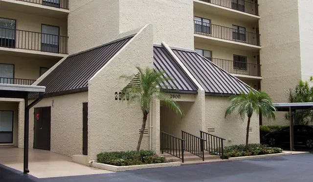 a kitchen with stainless steel appliances a refrigerator and cabinets