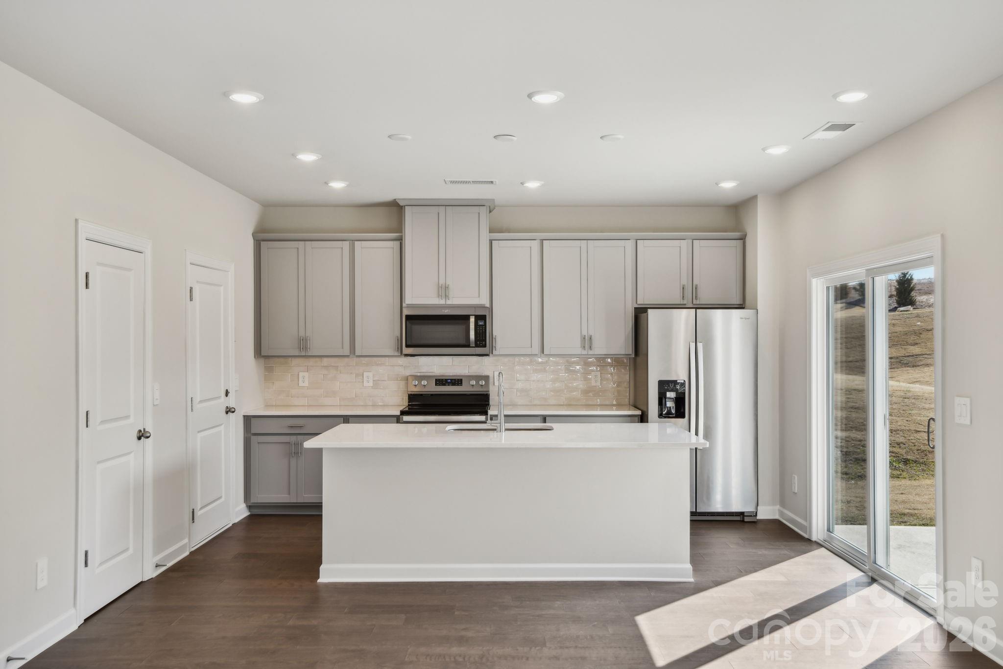 1346 30th St Lane Northeast Conover, NC 28613 - Photo 2 of 13 a kitchen with stainless steel appliances a refrigerator sink and white cabinets