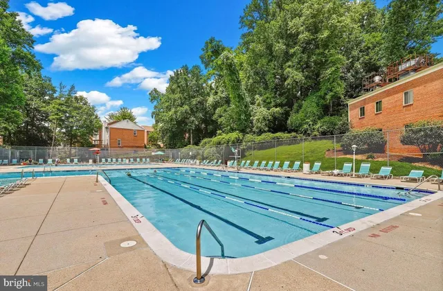 a view of swimming pool with a yard