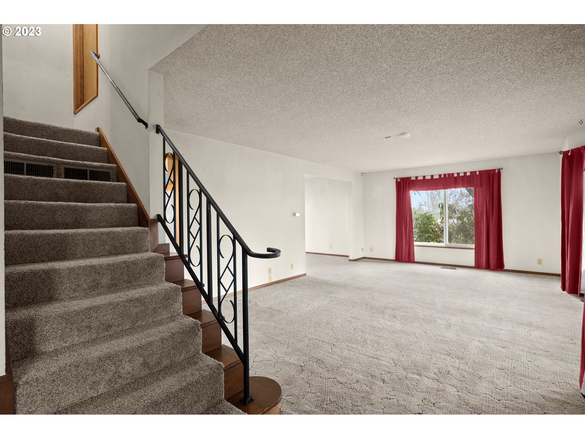 1934 Southwest Stringtown Road Forest Grove, OR 97116 - Photo 11 of 29 a view of an empty room with stairs and a window