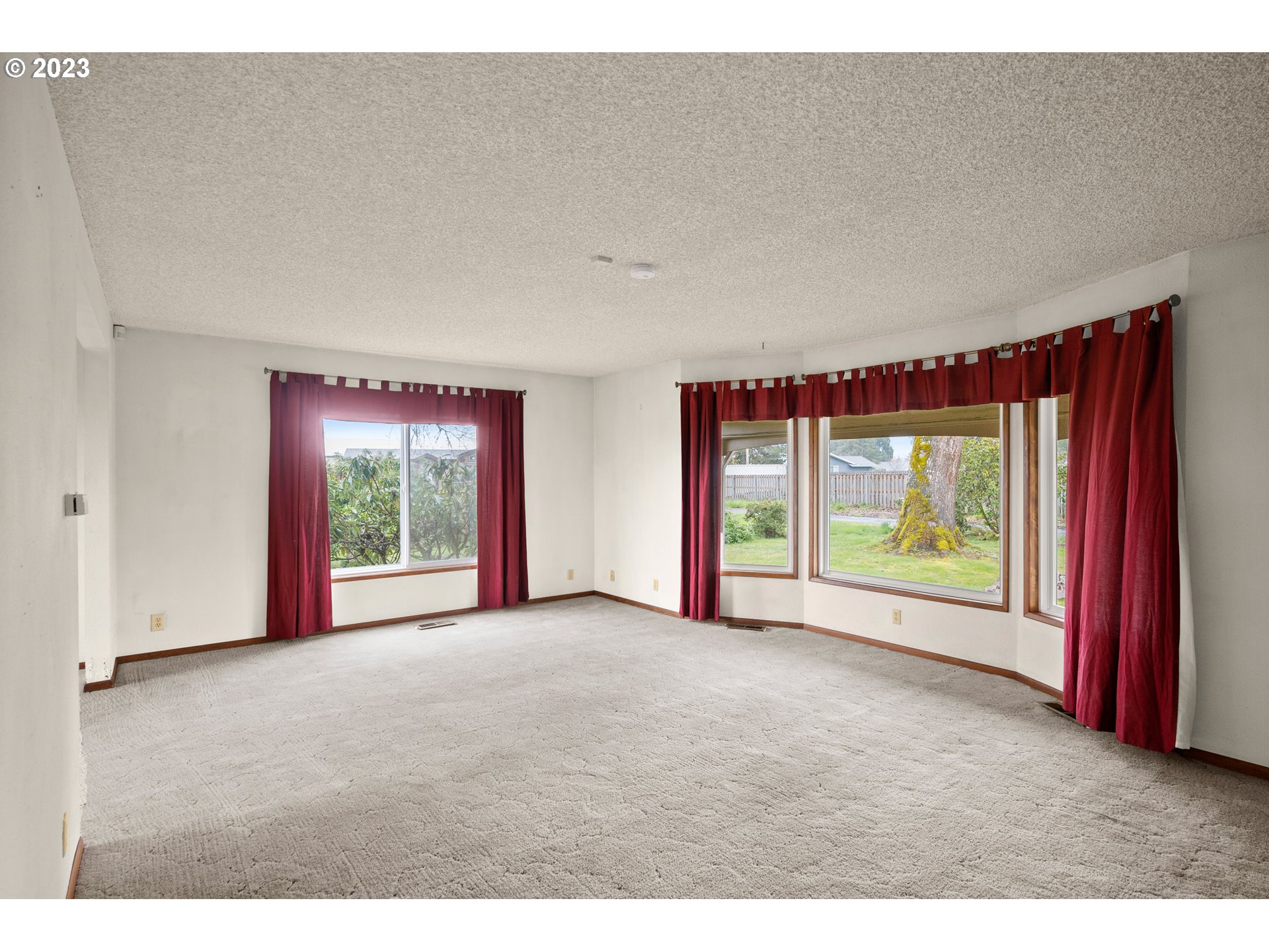 1934 Southwest Stringtown Road Forest Grove, OR 97116 - Photo 13 of 29 a view of empty room with floor to ceiling window and an outdoor kitchen