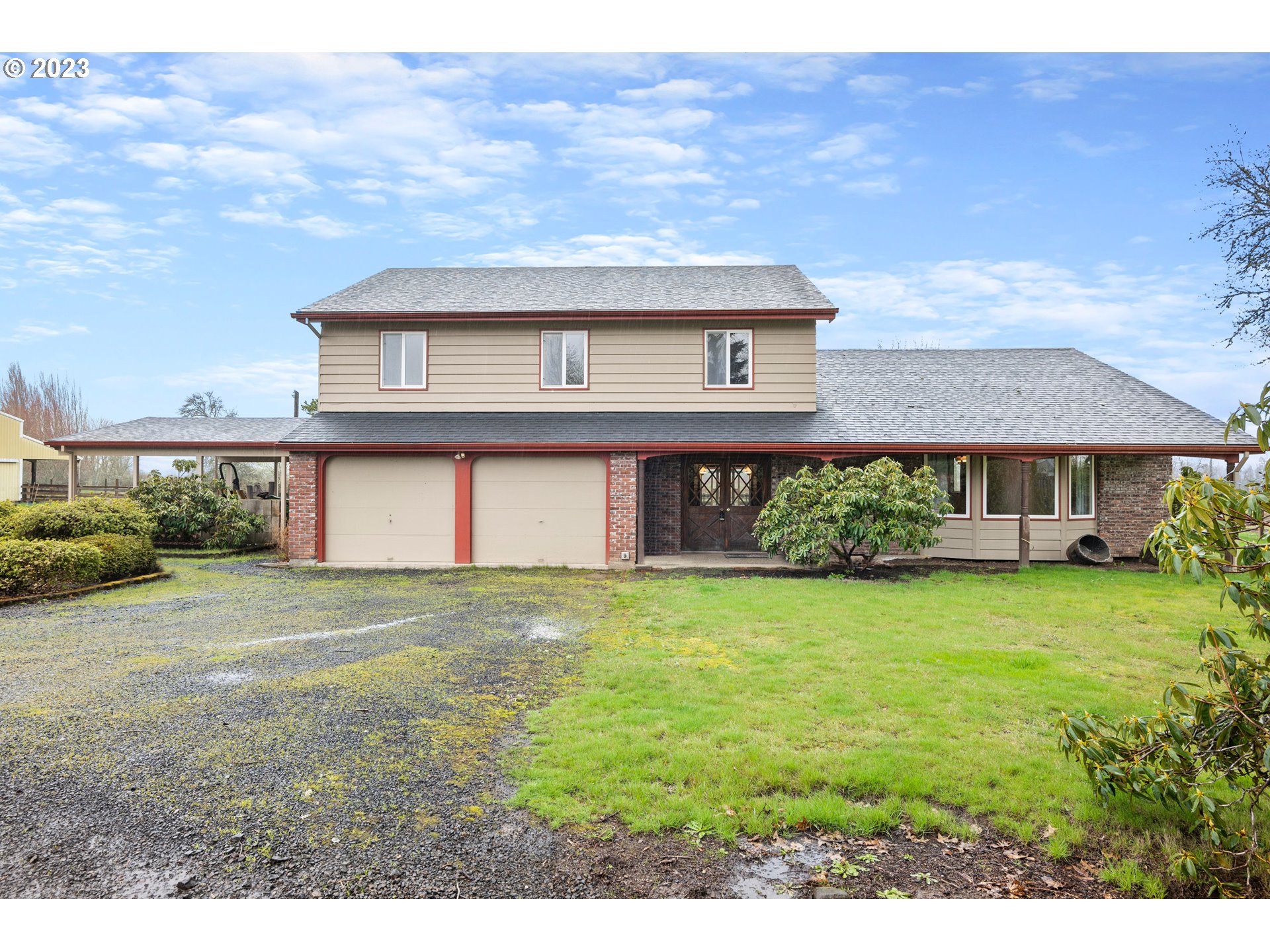 1934 Southwest Stringtown Road Forest Grove, OR 97116 - Photo 2 of 29 a view of a house with a yard and a large tree