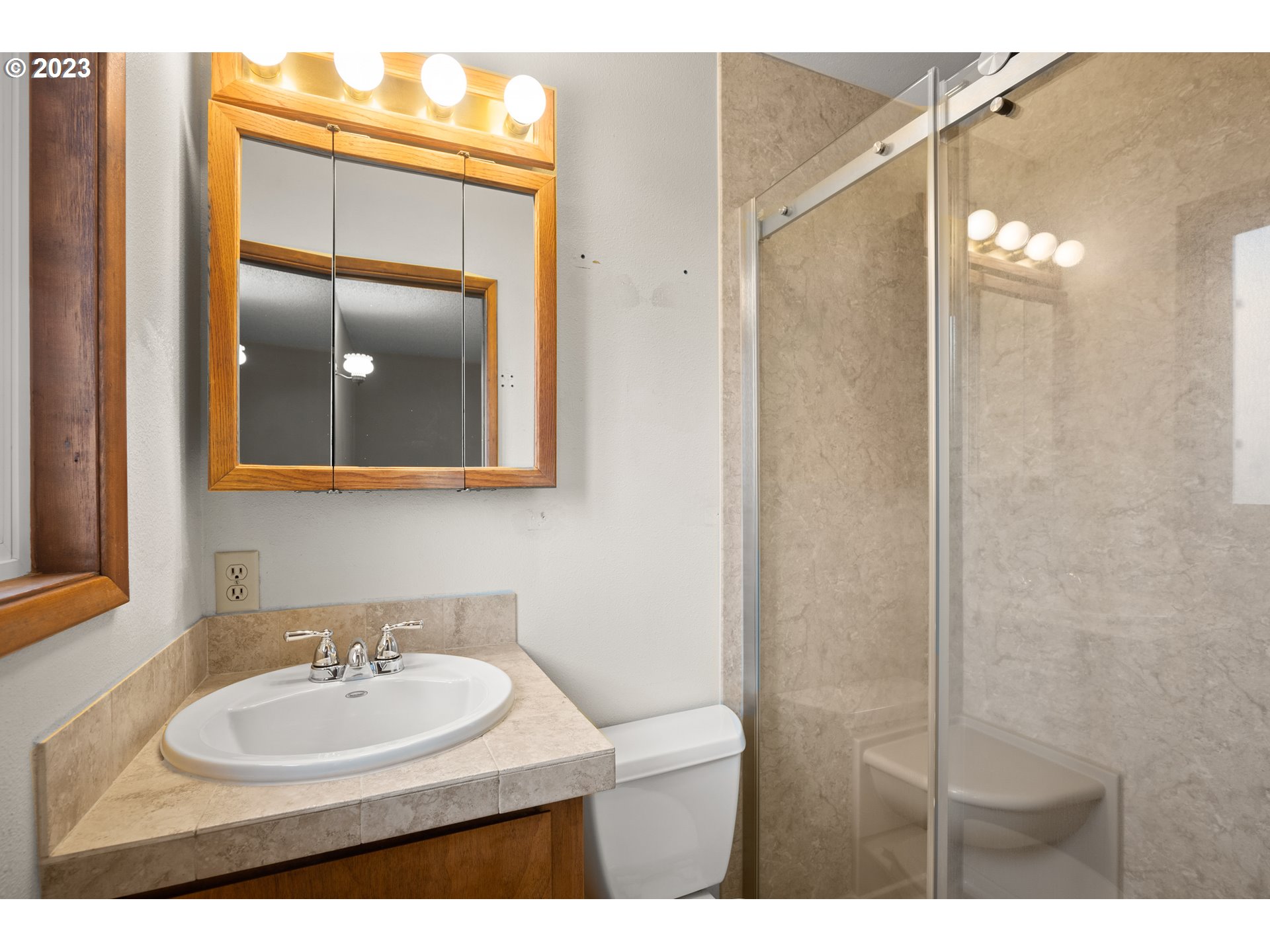 1934 Southwest Stringtown Road Forest Grove, OR 97116 - Photo 22 of 29 a bathroom with a sink mirror and vanity